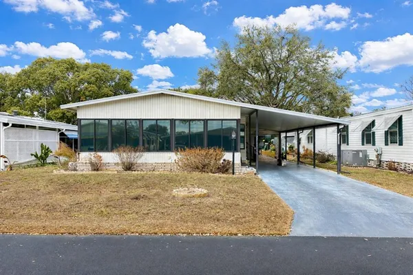 a house view with a sitting space and garden space