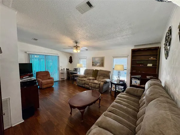 a living room with furniture and a lamp
