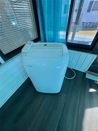 a view of a balcony with wooden floor