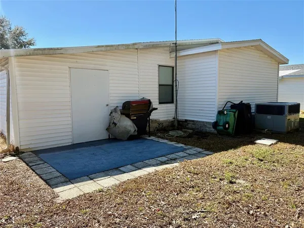 a view of a backyard with furniture