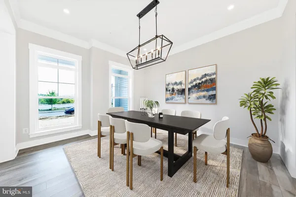 a view of a dining room with furniture and window