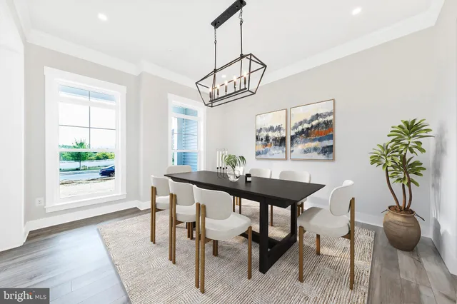 a view of a dining room with furniture and window