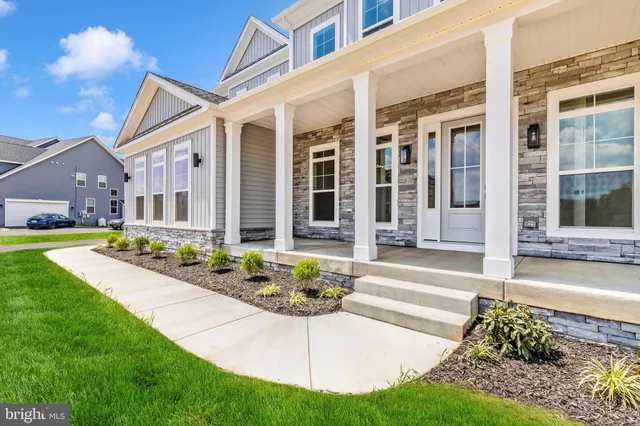 a garden view with a bench in the forest