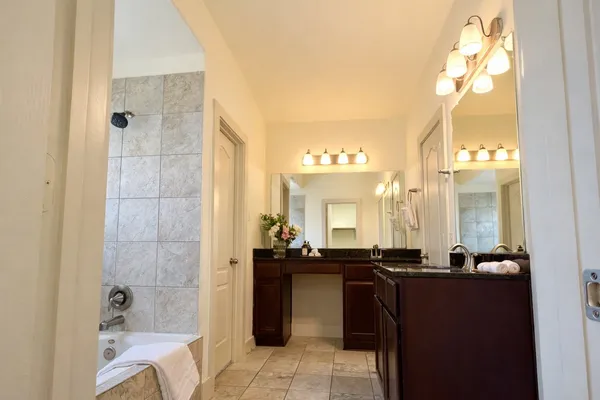 a bathroom with a bathtub and a sink