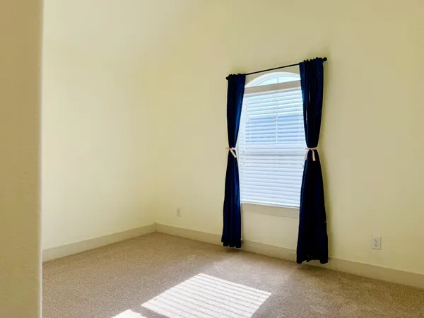 a bedroom with a bed and chair