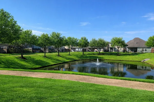 a view of a street with a park