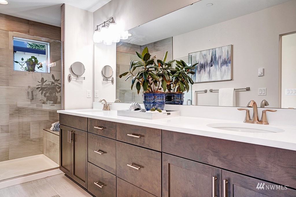 518 238th Street Southeast, Unit A Bothell, WA 98021 - Photo 16 of 31 a bathroom with a double vanity sink mirror and next to a white door