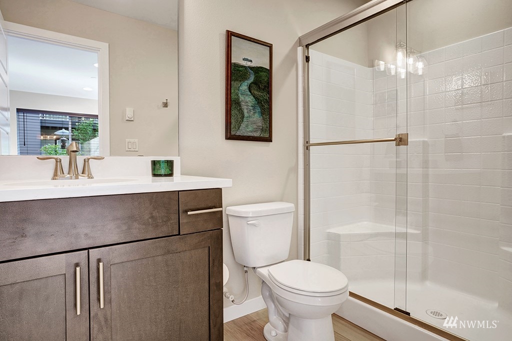 518 238th Street Southeast, Unit A Bothell, WA 98021 - Photo 21 of 31 a bathroom with a sink a toilet and shower