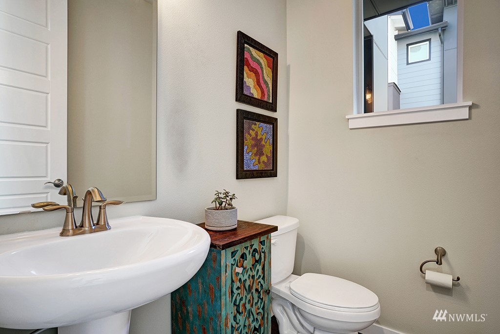 518 238th Street Southeast, Unit A Bothell, WA 98021 - Photo 26 of 31 a bathroom with a toilet a sink and mirror
