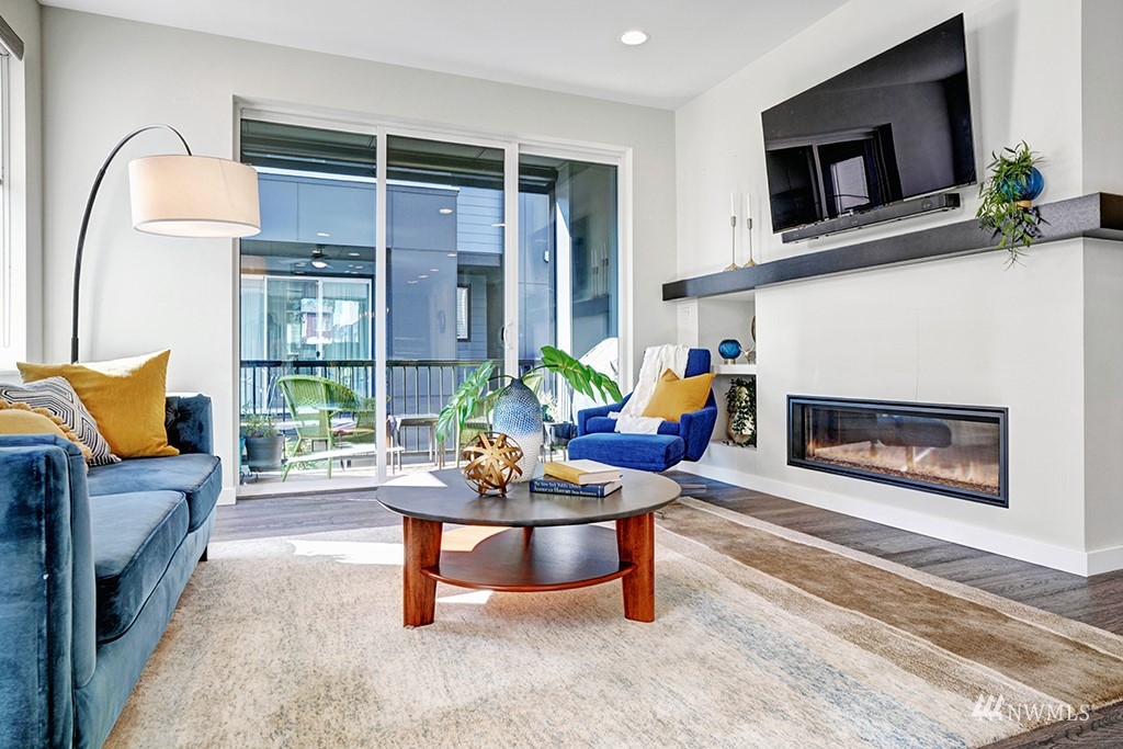 518 238th Street Southeast, Unit A Bothell, WA 98021 - Photo 5 of 31 a living room with furniture and a fireplace