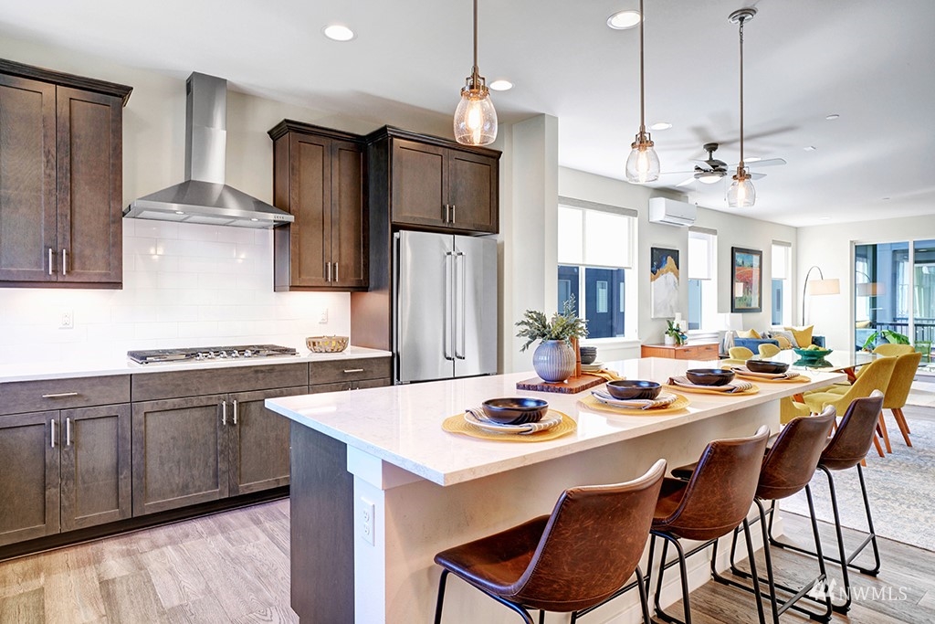 518 238th Street Southeast, Unit A Bothell, WA 98021 - Photo 6 of 31 a kitchen with a dining table and chairs