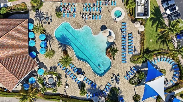 an aerial view of a house with outdoor space swimming pool and ocean view