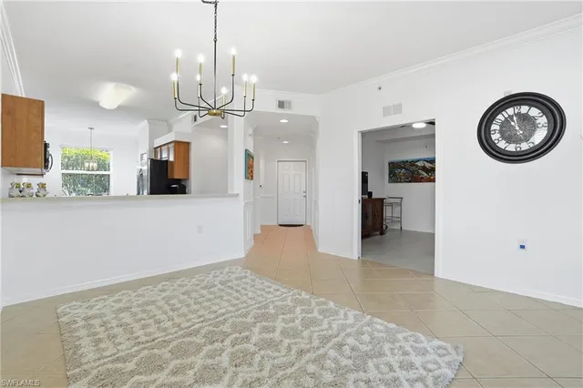 a view of a kitchen with a sink and a wooden floor