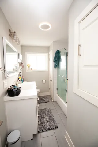 a bathroom with a sink toilet and shower