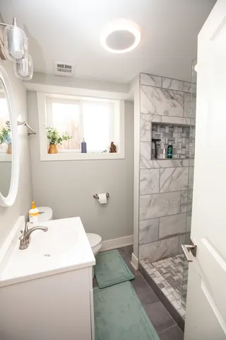 a bathroom with a sink and a mirror