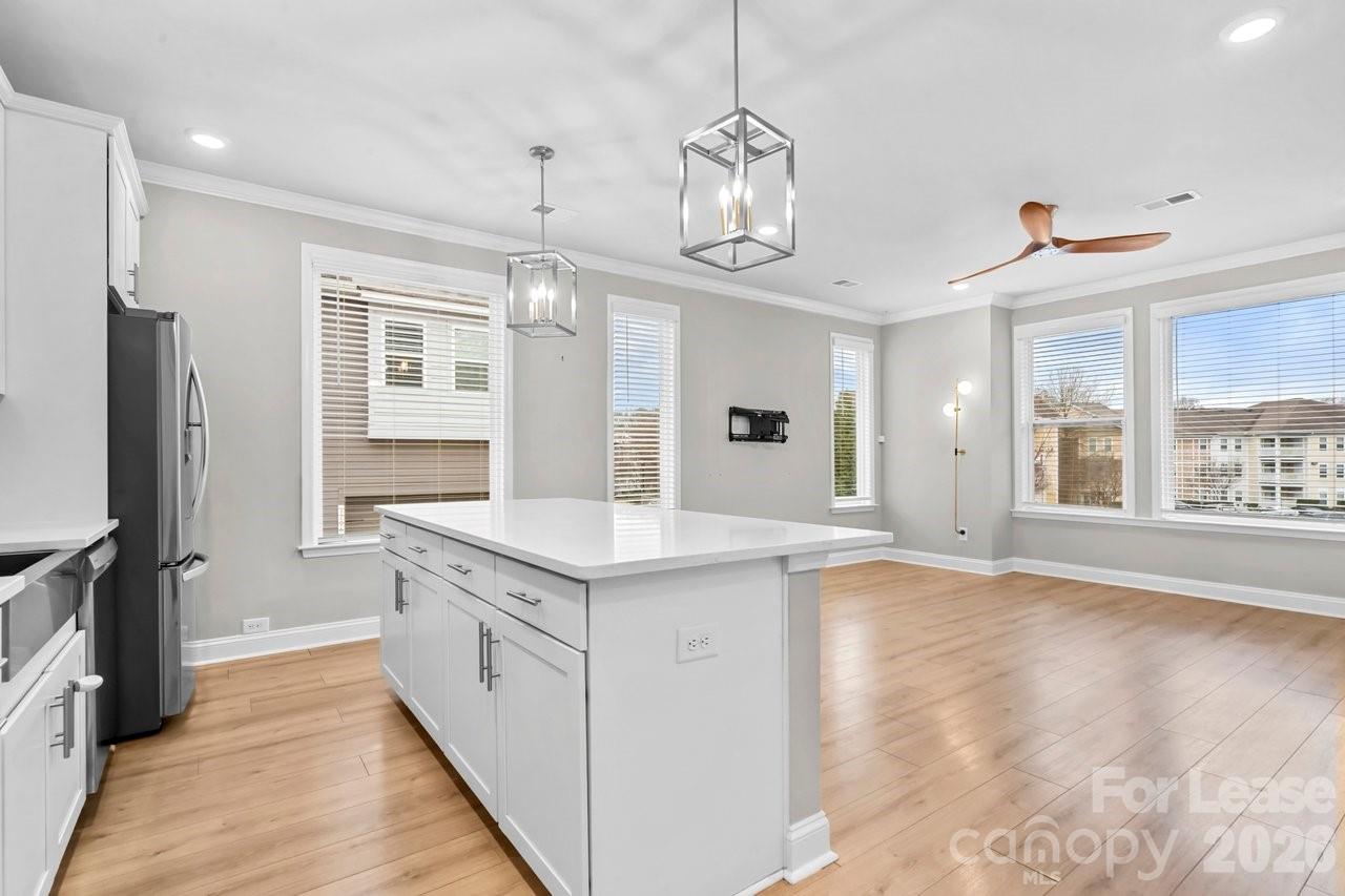 1515 Hidden Falls Road Charlotte, NC 28206 - Photo 13 of 35 a kitchen with a sink stove and refrigerator
