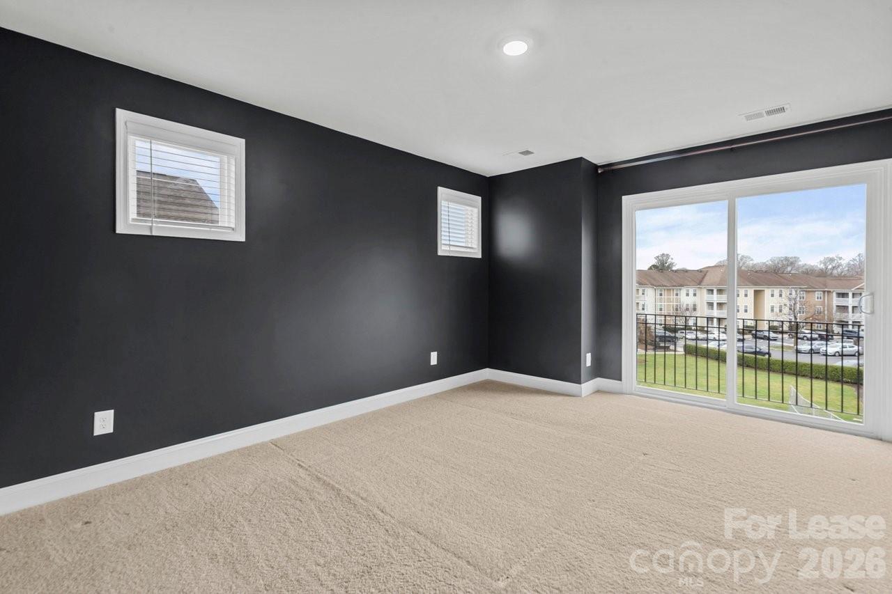 1515 Hidden Falls Road Charlotte, NC 28206 - Photo 18 of 35 a view of an empty room with a window