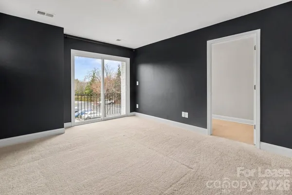 a view of an empty room with a balcony