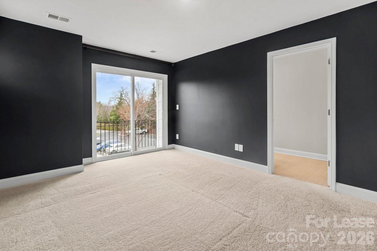 1515 Hidden Falls Road Charlotte, NC 28206 - Photo 19 of 35 a view of an empty room with a balcony