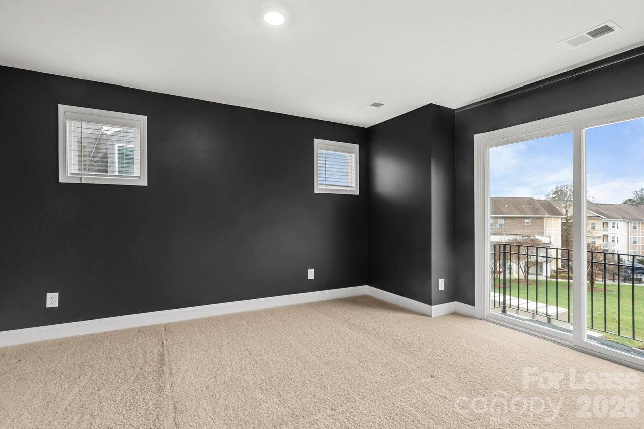 1515 Hidden Falls Road Charlotte, NC 28206 - Photo 20 of 35 a view of an empty room with a window