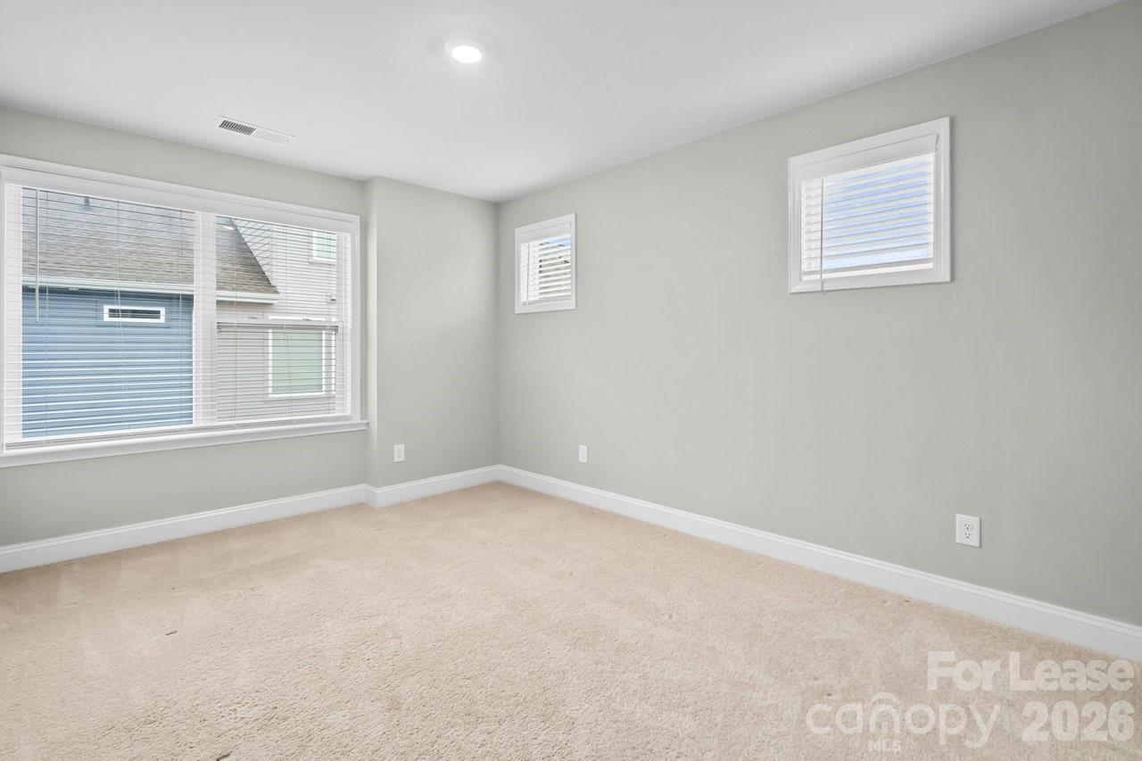 1515 Hidden Falls Road Charlotte, NC 28206 - Photo 26 of 35 a view of an empty room with a window