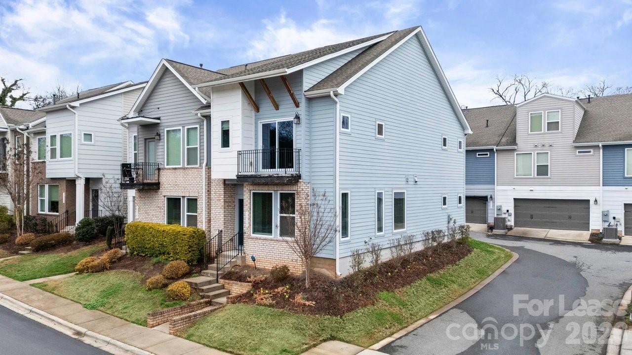 1515 Hidden Falls Road Charlotte, NC 28206 - Photo 3 of 35 a front view of a house with garden