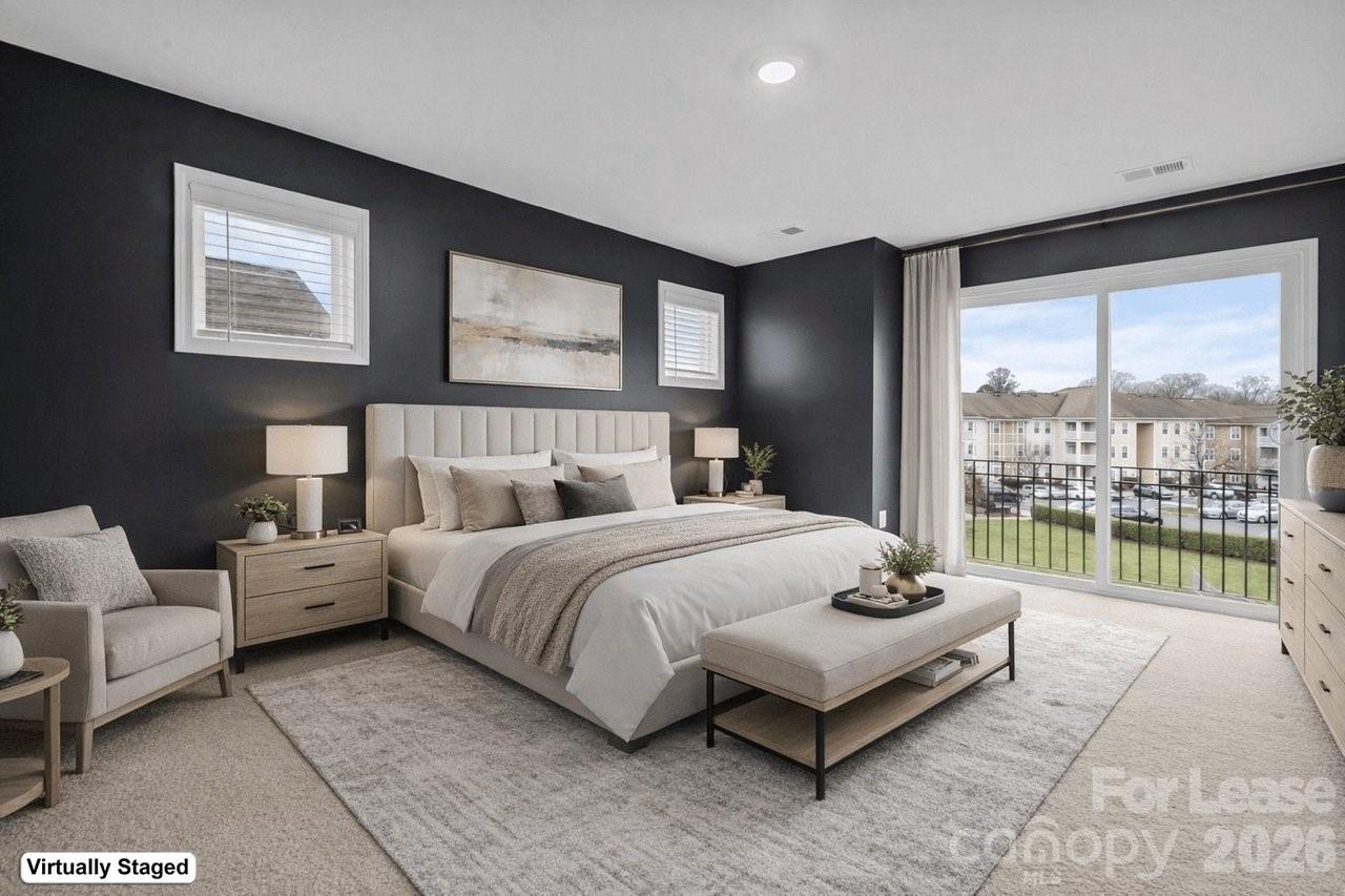 1515 Hidden Falls Road Charlotte, NC 28206 - Photo 31 of 35 a spacious bedroom with a bed and glass window
