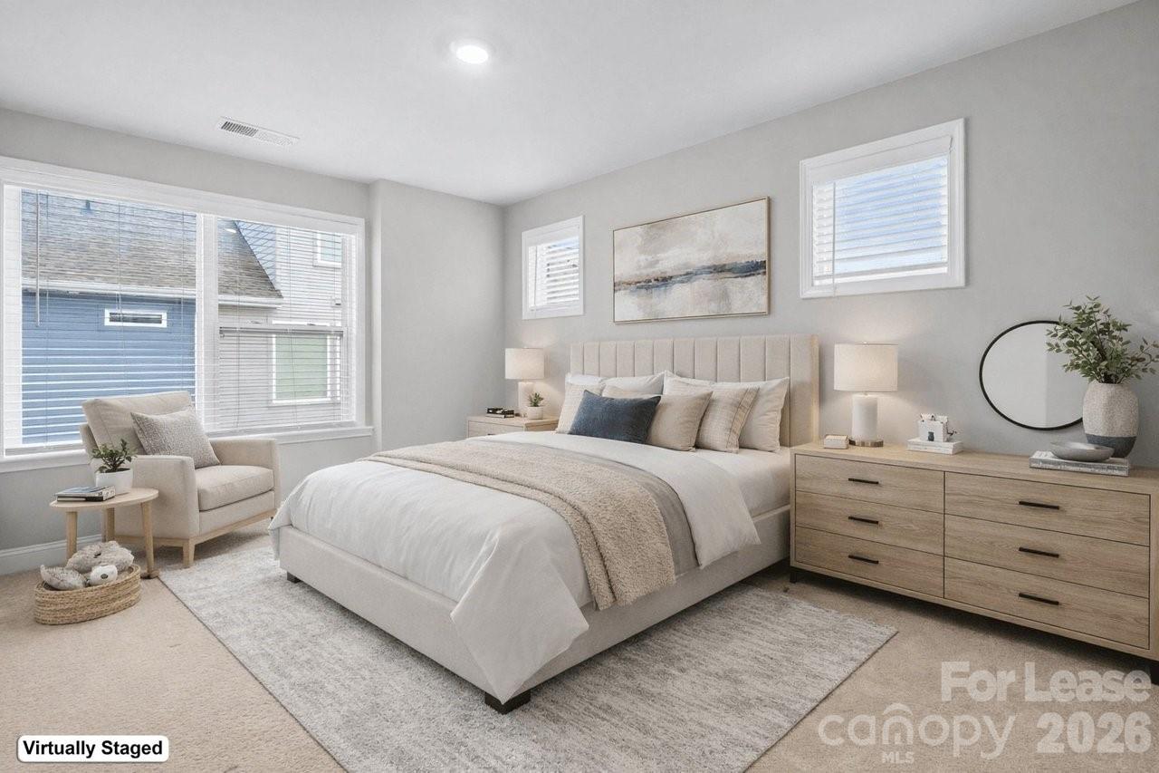 1515 Hidden Falls Road Charlotte, NC 28206 - Photo 32 of 35 a bedroom with a large bed and windows
