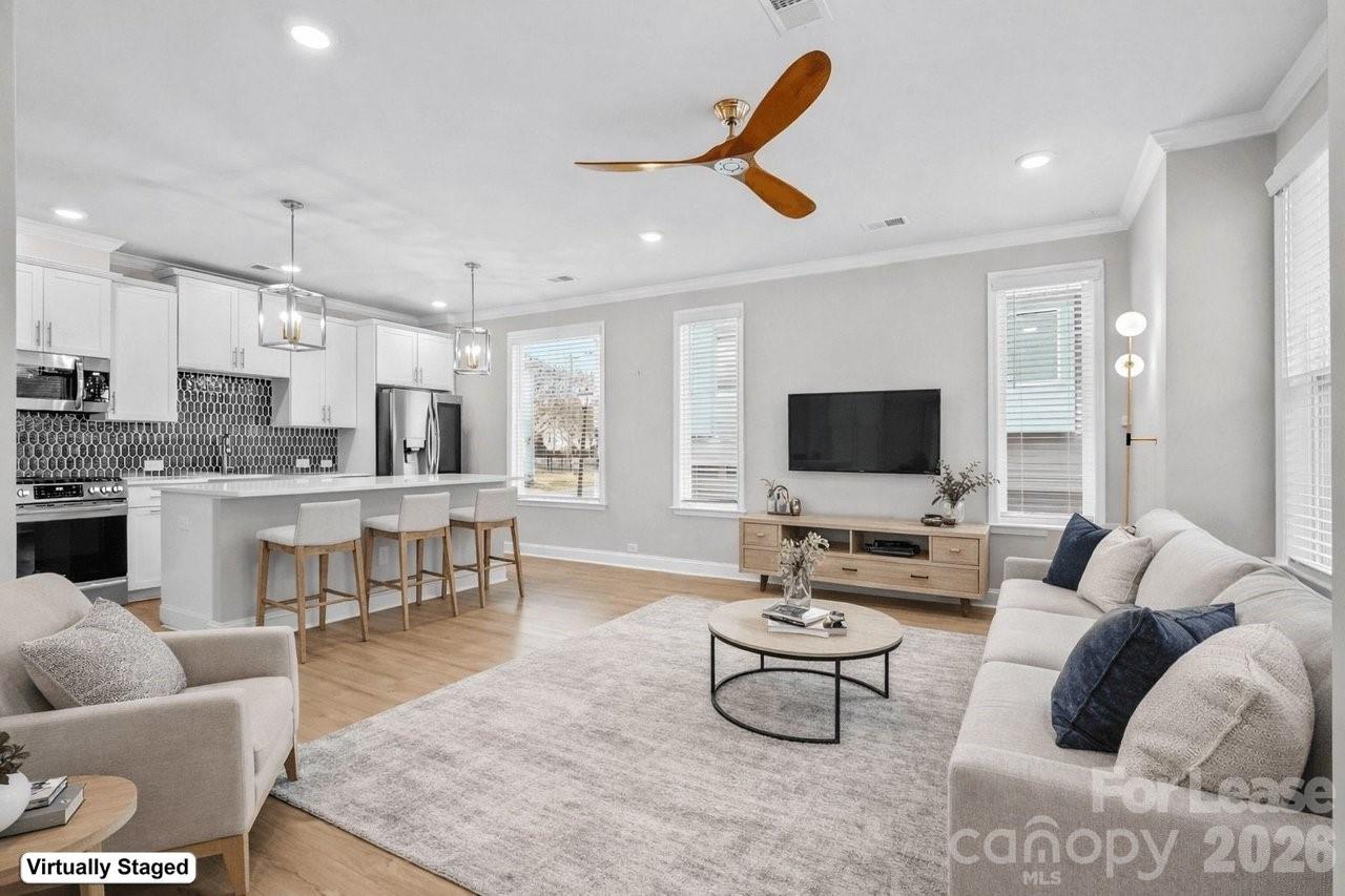 1515 Hidden Falls Road Charlotte, NC 28206 - Photo 33 of 35 a living room with furniture and a flat screen tv