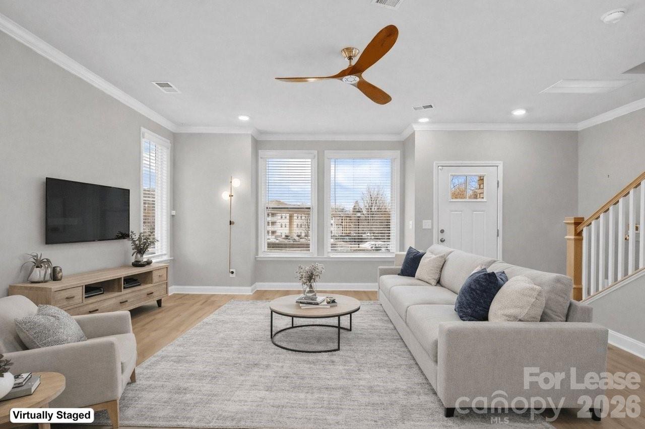1515 Hidden Falls Road Charlotte, NC 28206 - Photo 34 of 35 a living room with furniture and a flat screen tv