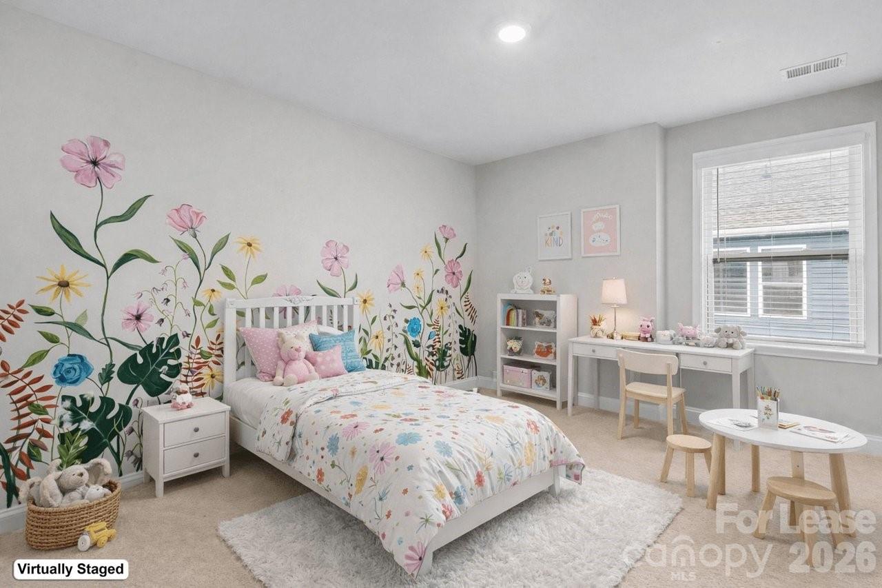 1515 Hidden Falls Road Charlotte, NC 28206 - Photo 35 of 35 a bedroom with a bed table flowerpot and window
