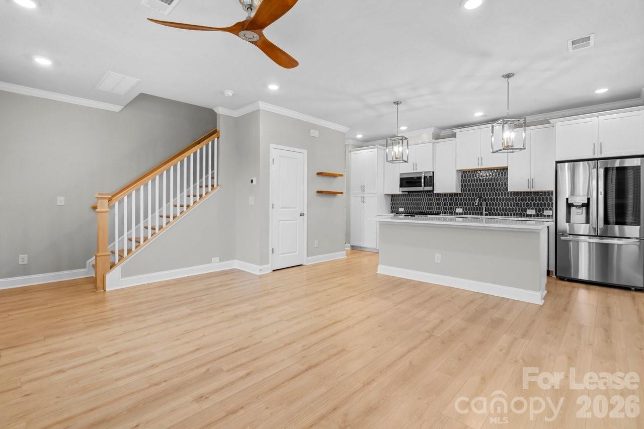 1515 Hidden Falls Road Charlotte, NC 28206 - Photo 7 of 35 a view of kitchen with wooden floor and electronic appliances