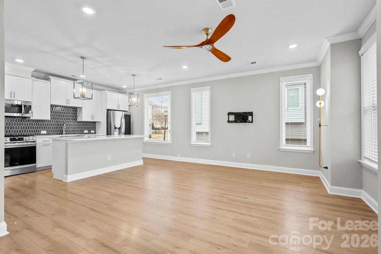 1515 Hidden Falls Road Charlotte, NC 28206 - Photo 8 of 35 a large kitchen with stainless steel appliances granite countertop a refrigerator and a stove top oven