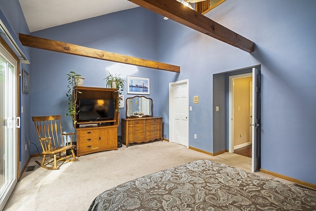 1541 Middlesex Street, Unit 16 Lowell, MA 01851 - Photo 11 of 29 a bedroom with a bed and a flat screen tv