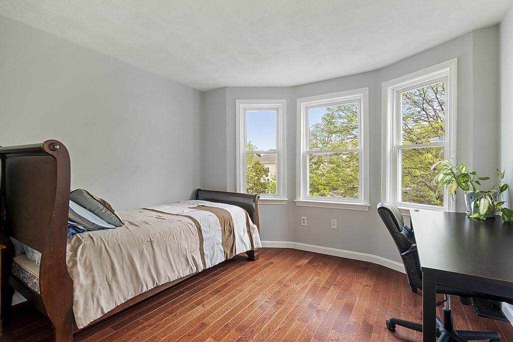 1541 Middlesex Street, Unit 16 Lowell, MA 01851 - Photo 14 of 29 a view of a bedroom with furniture and a window