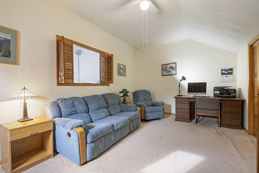 1541 Middlesex Street, Unit 16 Lowell, MA 01851 - Photo 16 of 29 a living room with furniture and a lamp