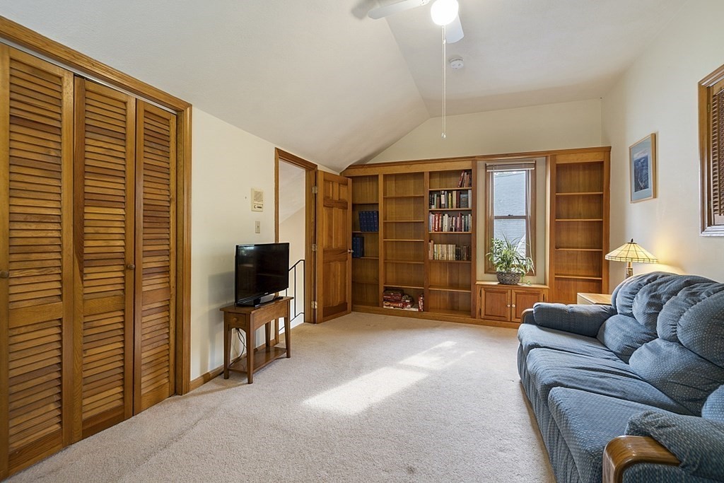 1541 Middlesex Street, Unit 16 Lowell, MA 01851 - Photo 17 of 29 a living room with furniture and a flat screen tv