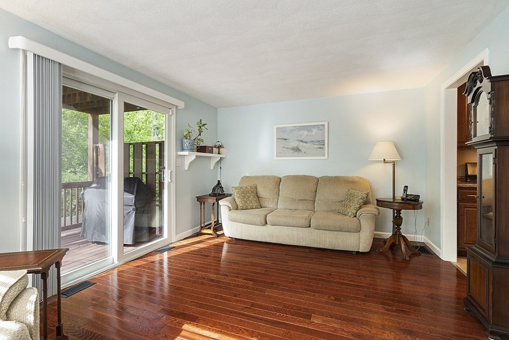1541 Middlesex Street, Unit 16 Lowell, MA 01851 - Photo 3 of 29 a living room with furniture and a large window