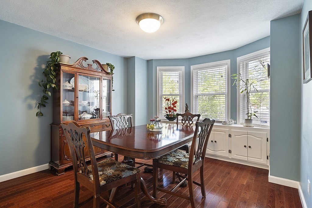 1541 Middlesex Street, Unit 16 Lowell, MA 01851 - Photo 5 of 29 a view of a dining room with furniture and wooden floor