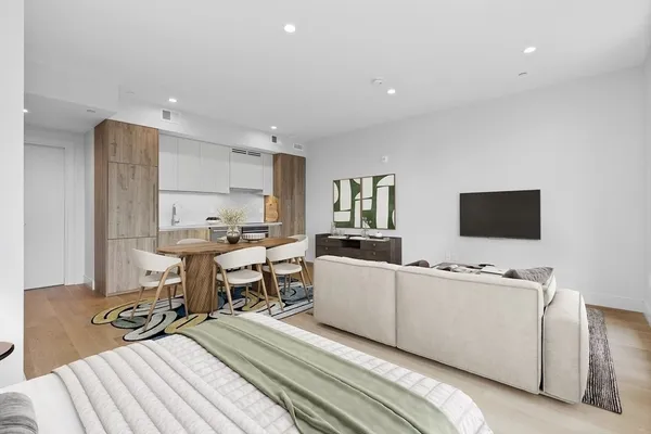 a room with furniture a flat screen tv and a table