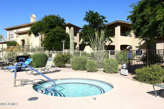 a view of a house with swimming pool and furniture