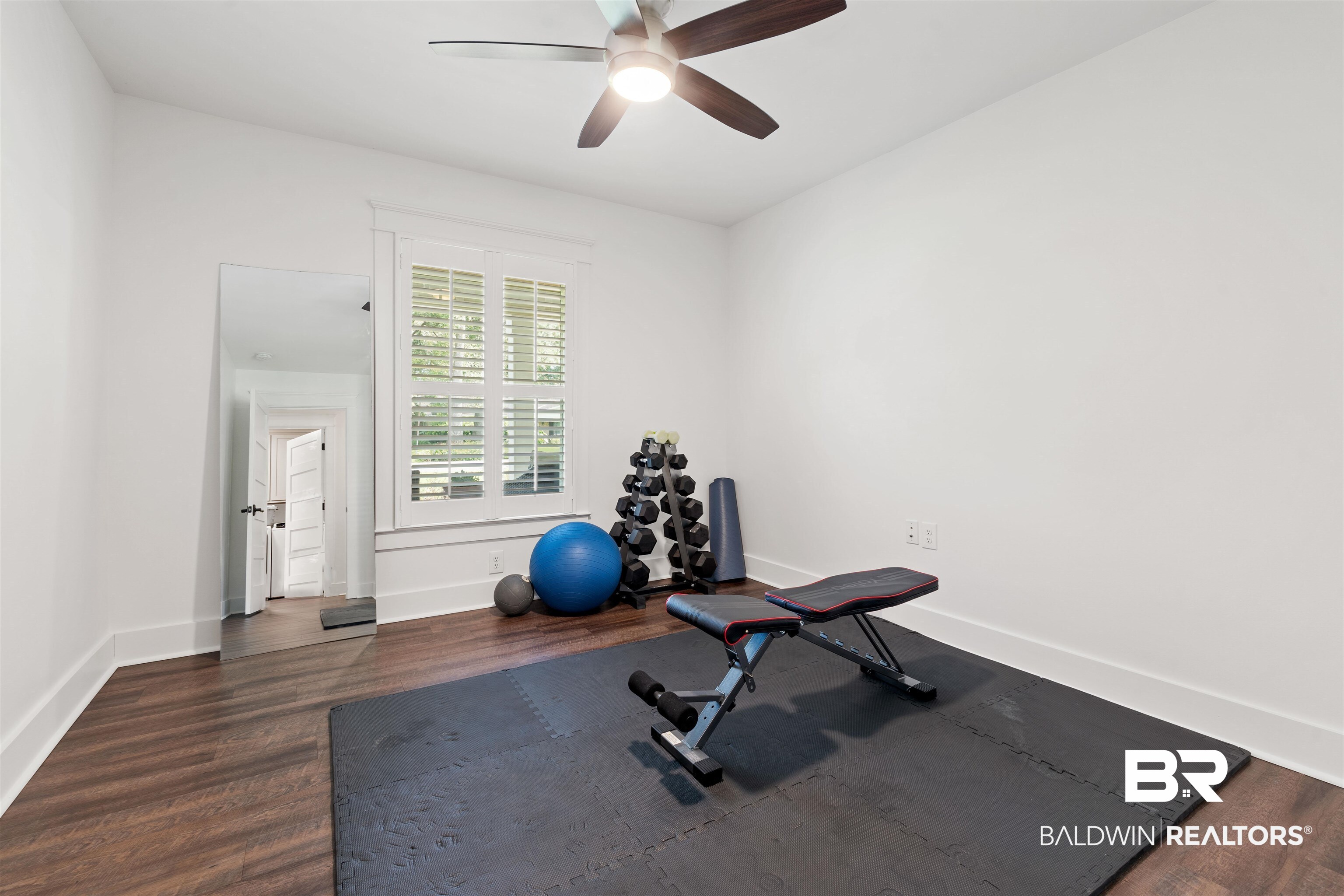 3808 Claridge Road North Mobile, AL 36608 - Photo 31 of 43 Exercise room featuring ceiling fan and dark hardwood / wood-style floors