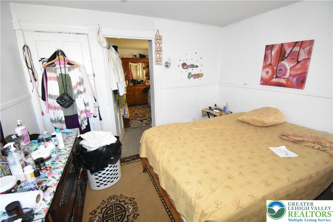 22 South Raspberry Street Easton, PA 18042 - Photo 12 of 16 a bed room with a bed and a couch