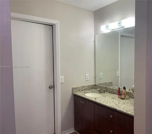 a bedroom with a bed and a cabinet
