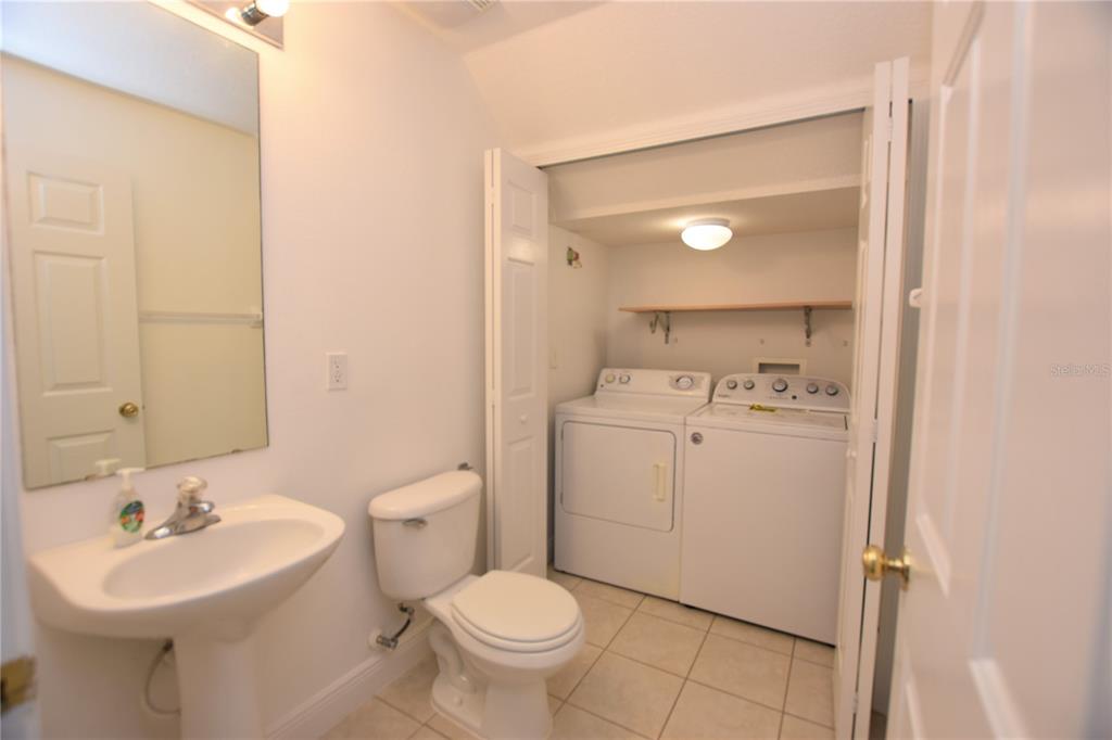 5410 River Rock Road Lakeland, FL 33809 - Photo 11 of 26 a bathroom with a sink toilet and a mirror