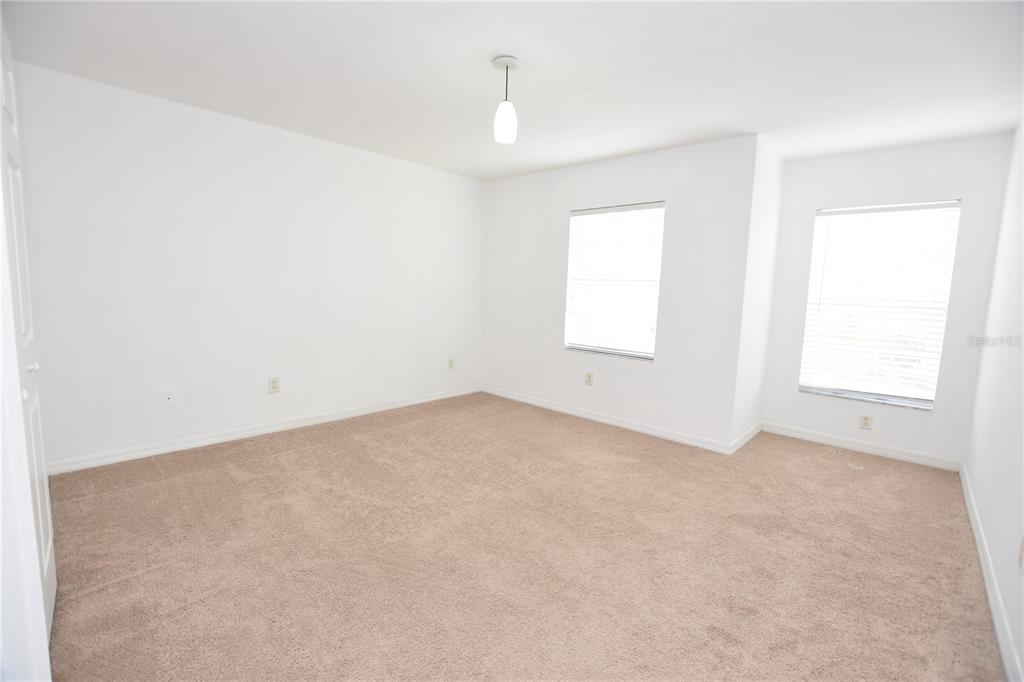 5410 River Rock Road Lakeland, FL 33809 - Photo 13 of 26 an empty room with windows and closet