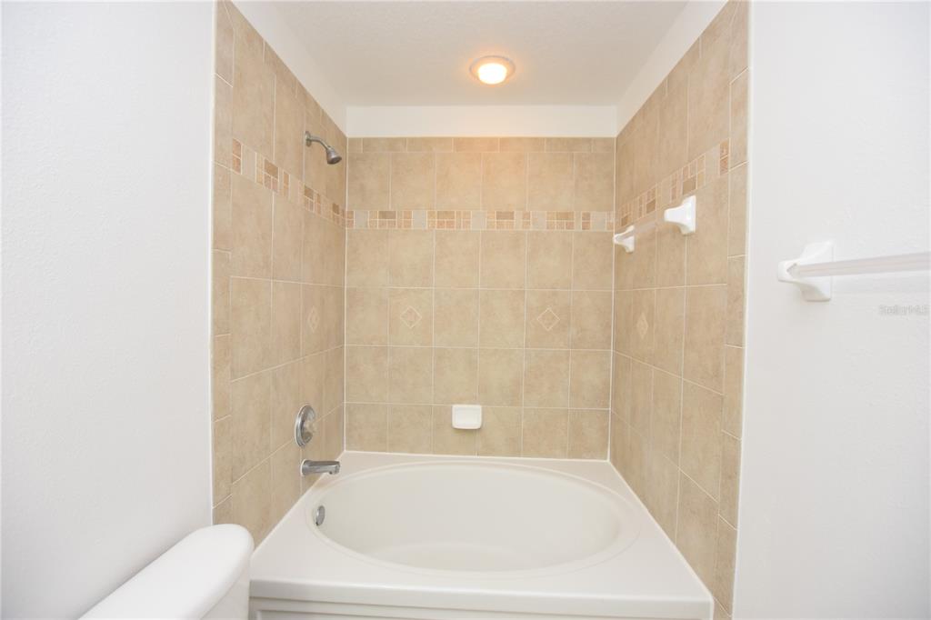 5410 River Rock Road Lakeland, FL 33809 - Photo 15 of 26 a bathroom with a bathtub