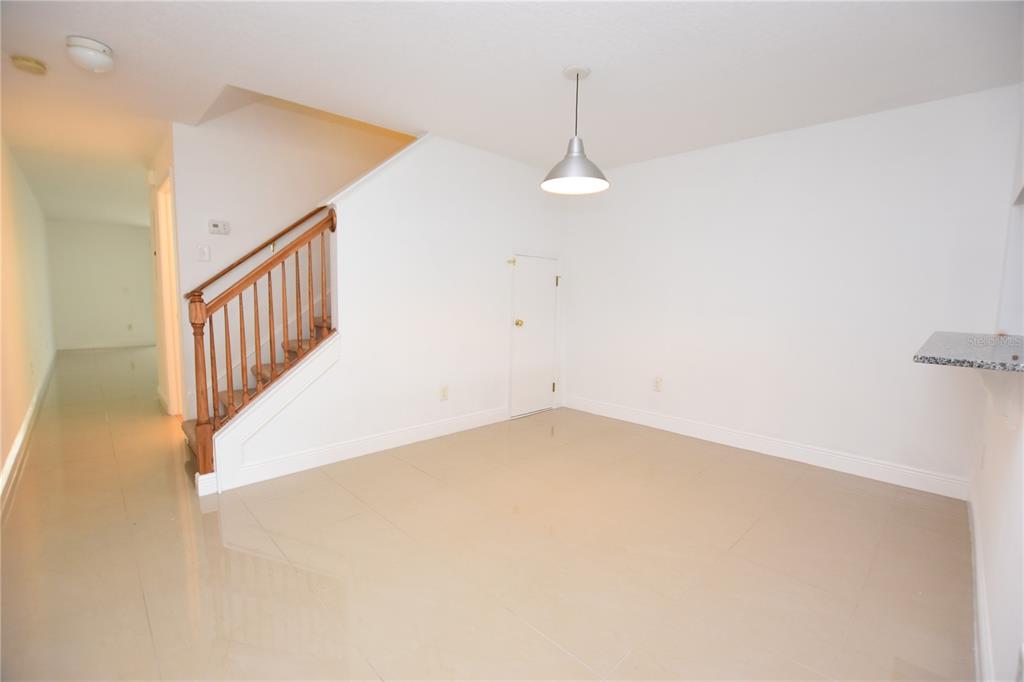 5410 River Rock Road Lakeland, FL 33809 - Photo 6 of 26 a view of an empty room with wooden floor