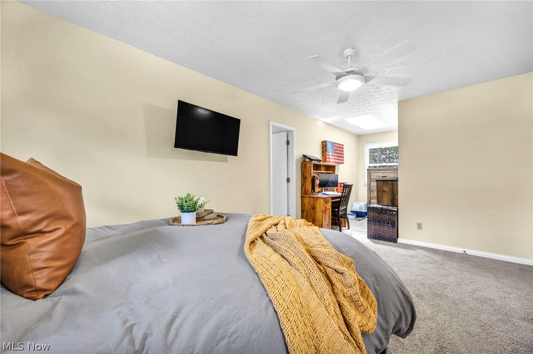 3005 Kendall Road Akron, OH 44321 - Photo 33 of 46 Carpeted bedroom with a textured ceiling and ceiling fan