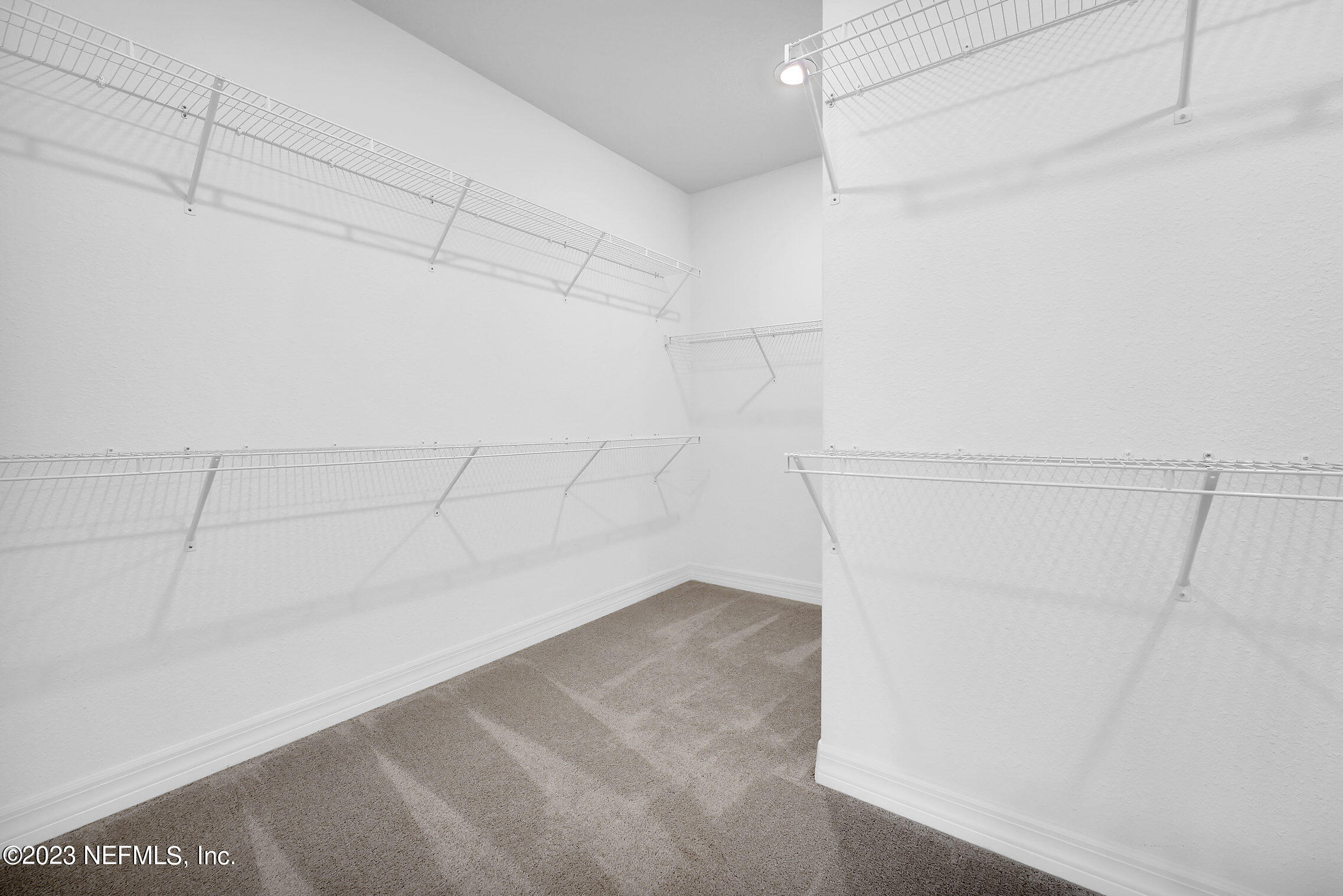 128 Continuum Loop Yulee, FL 32097 - Photo 14 of 29 Stardom Owner's Walk-In Closet